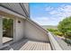 Balcony with a peek of water views and coastal foliage at 341 Seabrook Island Rd, Seabrook Island, SC 29455