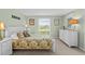 Bright bedroom with white furniture and colorful bedding at 341 Seabrook Island Rd, Seabrook Island, SC 29455