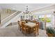 Bright dining room featuring a stylish chandelier and seating for six at 341 Seabrook Island Rd, Seabrook Island, SC 29455