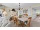 Bright dining room featuring a stylish chandelier, a wet bar and seating for six at 341 Seabrook Island Rd, Seabrook Island, SC 29455
