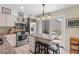 Well-equipped kitchen with stainless steel appliances, granite countertops and an outdoor patio at 341 Seabrook Island Rd, Seabrook Island, SC 29455