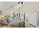 Spacious main bedroom with high ceilings, a ceiling fan, and access to a private balcony at 341 Seabrook Island Rd, Seabrook Island, SC 29455