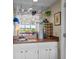 A modern wet bar with a sink, wine rack, and mirrored glass shelves at 341 Seabrook Island Rd, Seabrook Island, SC 29455