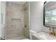 Updated bathroom boasts a tiled shower with niche, modern fixtures, and granite counter at 400 Tammie Ave, Goose Creek, SC 29445