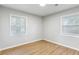 Bedroom features hardwood floors and two windows, offering plenty of natural light at 400 Tammie Ave, Goose Creek, SC 29445