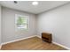 Bedroom features hardwood floors, a window, and small bedside table at 400 Tammie Ave, Goose Creek, SC 29445