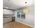 Bright kitchen showcasing white cabinets, stainless steel appliances, butcher block counters, and a contemporary wicker pendant light at 400 Tammie Ave, Goose Creek, SC 29445