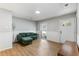 Cozy living room with wainscotting, wood floors, modern furniture, and a large window offering plenty of natural light at 400 Tammie Ave, Goose Creek, SC 29445
