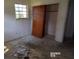 Bedroom with closet, window and debris on the floor at 403 Bryan St, Summerville, SC 29483