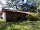 Exterior view of the house with grass and trees surrounding it at 403 Bryan St, Summerville, SC 29483