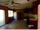 Kitchen with wood paneling, standard appliances, and a ceiling fan at 403 Bryan St, Summerville, SC 29483