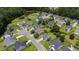 Aerial shot of home showcasing the neighborhood, nearby pond, and lush green surroundings at 406 Brookfield Ln, Goose Creek, SC 29445