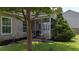 Well-maintained backyard featuring lush lawn and mature trees with a view of screened-in porch at 406 Brookfield Ln, Goose Creek, SC 29445