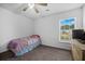Cozy bedroom features neutral walls, carpet, and a window with natural light at 406 Brookfield Ln, Goose Creek, SC 29445