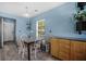 Cozy dining area features a wooden table, seating for four, and natural light at 406 Brookfield Ln, Goose Creek, SC 29445