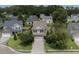 Two-story home with manicured lawn, driveway, and mature trees in a residential neighborhood at 406 Brookfield Ln, Goose Creek, SC 29445