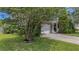 Home with well-manicured lawn and mature landscaping at 406 Brookfield Ln, Goose Creek, SC 29445