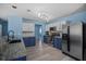 This kitchen includes stainless appliances, granite counters, and plenty of storage, and open to the dining area at 406 Brookfield Ln, Goose Creek, SC 29445