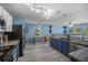 The kitchen boasts stainless steel appliances, granite countertops, and an open layout to the living area at 406 Brookfield Ln, Goose Creek, SC 29445