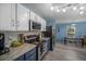 Bright kitchen features modern appliances, two-tone cabinetry, and a spacious dining area at 406 Brookfield Ln, Goose Creek, SC 29445