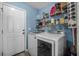 Efficient laundry room with modern washer and dryer, shelving and storage space at 406 Brookfield Ln, Goose Creek, SC 29445