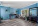 Blue living room with large window, offering ample natural light and decor at 406 Brookfield Ln, Goose Creek, SC 29445