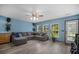 Comfortable living room with a large sectional sofa, natural light, and modern decor at 406 Brookfield Ln, Goose Creek, SC 29445