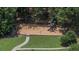 Community playground featuring swings, slides, and a soft landing surface for children to enjoy at 406 Brookfield Ln, Goose Creek, SC 29445