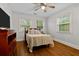 Cozy bedroom with hardwood floors, neutral walls, and lots of natural light streaming through window blinds at 416 Altman St, Moncks Corner, SC 29461