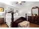 Spacious bedroom with wood floors, a ceiling fan and windows. A chest is at the foot of the bed at 416 Altman St, Moncks Corner, SC 29461