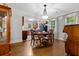 Warm dining area features a table set for four and views into the updated kitchen for easy entertaining at 416 Altman St, Moncks Corner, SC 29461