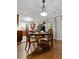 Dining room showcases a stylish table and chairs, complemented by an elegant chandelier and hardwood flooring at 416 Altman St, Moncks Corner, SC 29461