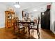 Charming dining area boasts an elegant table, chairs, and decorative china cabinet with views into the kitchen at 416 Altman St, Moncks Corner, SC 29461