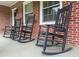 Charming front porch featuring classic rocking chairs and a welcoming, traditional brick facade at 416 Altman St, Moncks Corner, SC 29461