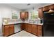 Well-lit kitchen boasts stainless appliances, ample counter space, and custom cabinetry, great for meal prep at 416 Altman St, Moncks Corner, SC 29461