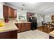 Spacious kitchen features updated cabinetry, countertops, and a stainless steel refrigerator, great for cooking at 416 Altman St, Moncks Corner, SC 29461
