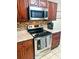 Updated kitchen features a stainless steel stove, microwave, and tiled backsplash, creating a modern look at 416 Altman St, Moncks Corner, SC 29461