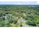 High aerial shot of neighborhood showing roof lines with interspersed mature trees providing good coverage at 422 Geddes Ave, Charleston, SC 29407