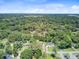 An aerial perspective of a neighborhood with mature trees offering ample coverage and dispersed residences at 422 Geddes Ave, Charleston, SC 29407