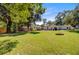 The large grassy backyard provides ample space for activities and features a fire pit and ample seating areas for outdoor enjoyment at 422 Geddes Ave, Charleston, SC 29407