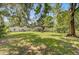 Serene backyard setting with mature trees offering plenty of shade, a well-maintained lawn, and a peaceful atmosphere at 422 Geddes Ave, Charleston, SC 29407