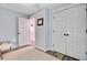Bright bedroom with a closet, and door to another room showcasing the hardwood floors and neutral paint at 422 Geddes Ave, Charleston, SC 29407