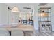 Dining area with rustic shelving and seamless transition to the kitchen, a cozy space at 422 Geddes Ave, Charleston, SC 29407