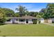 Charming single-story home with a lush green lawn and traditional architectural details at 422 Geddes Ave, Charleston, SC 29407