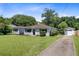 Inviting home with a well-manicured lawn, long driveway, and a detached garage at 422 Geddes Ave, Charleston, SC 29407