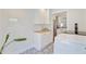 Efficient laundry area with ample cabinet space, modern appliances, and decorative tile flooring at 422 Geddes Ave, Charleston, SC 29407