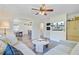 Stylish living room and dining room showcasing a comfortable sectional sofa, stylish decor, and lots of natural light at 422 Geddes Ave, Charleston, SC 29407