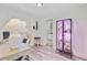 Home office with a window, desk, chair, and a plant display with purple-tinted grow lights at 422 Geddes Ave, Charleston, SC 29407