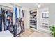 Spacious walk-in closet with built-in shelving and easy access to the bathroom at 422 Geddes Ave, Charleston, SC 29407