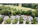 Aerial perspective of a home situated near a scenic golf course, surrounded by established trees and greenery at 4969 Franconia Dr, Summerville, SC 29485